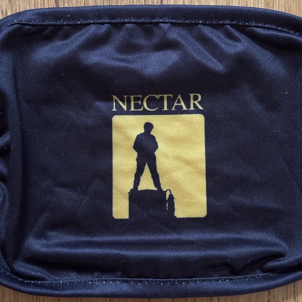 Black and yellow Joji Nectar face mask.